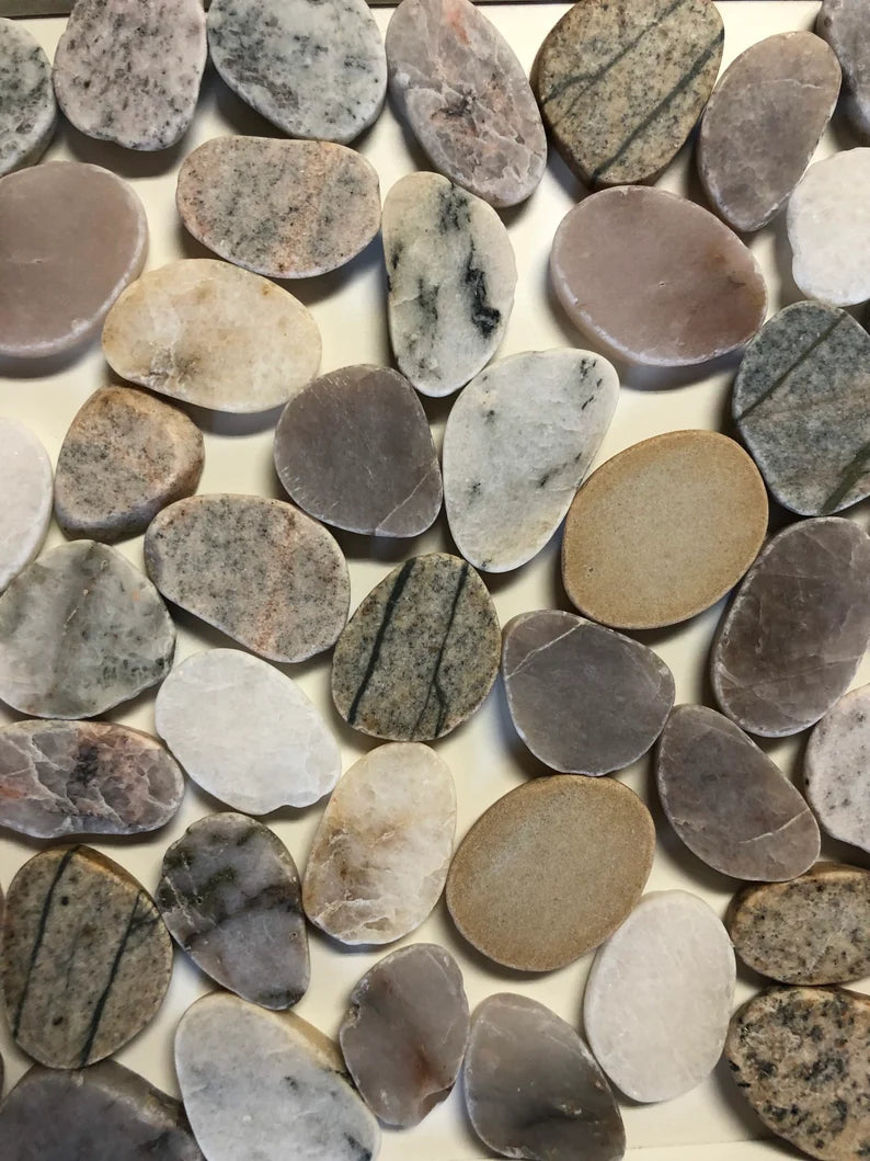 A collection of sliced stone showing the varying tones and patterns of the knobs.