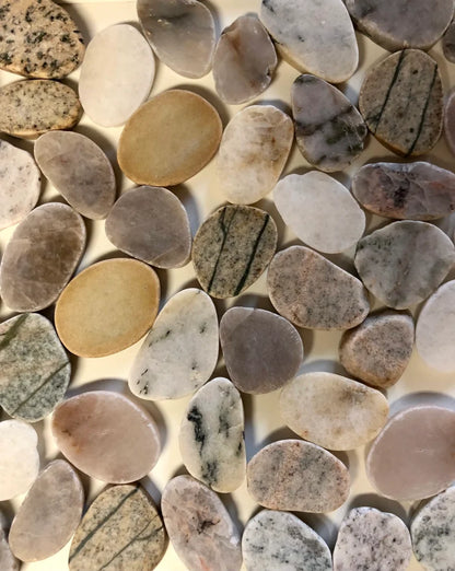 A collection of sliced stone showing the varying tones and patterns of the knobs.